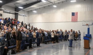 A person speaking at an assembly